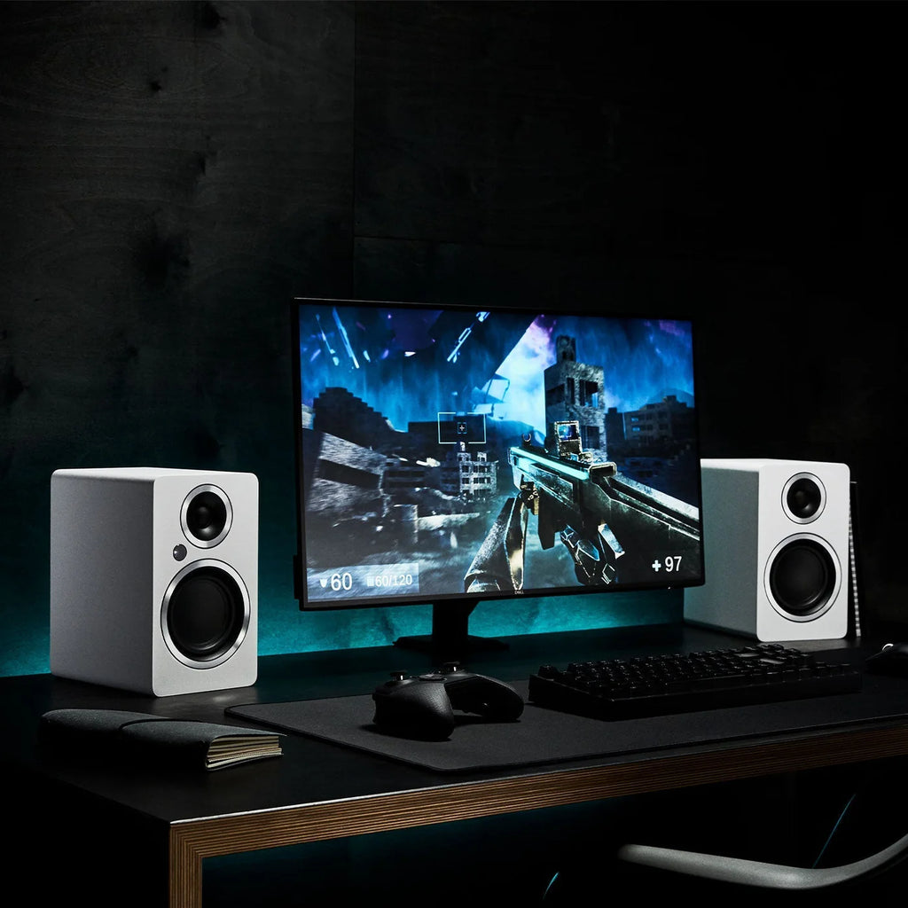 Argon Audio Fenris A4 active bookshelf speakers in white with black speaker cones and sleek modern design.