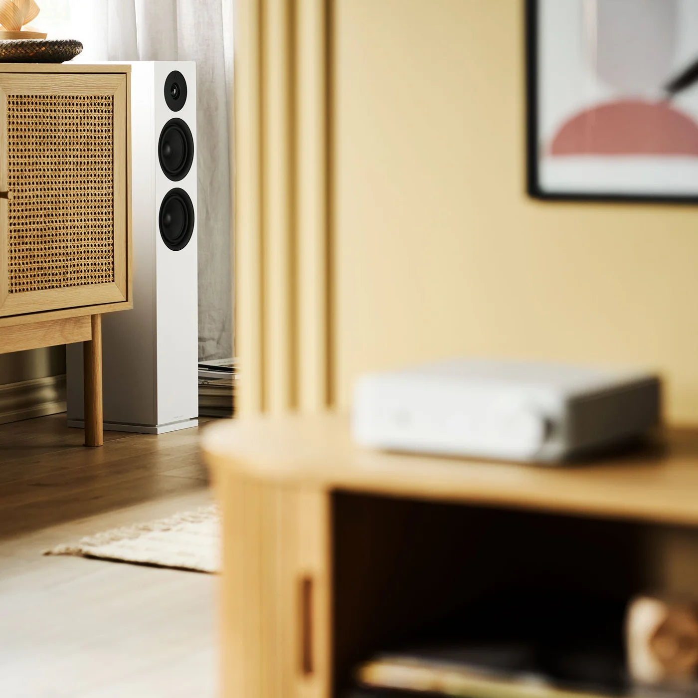Argon Audio Forus 55 passive floorstanding speakers in white, showcasing sleek design and tall speaker cabinets.