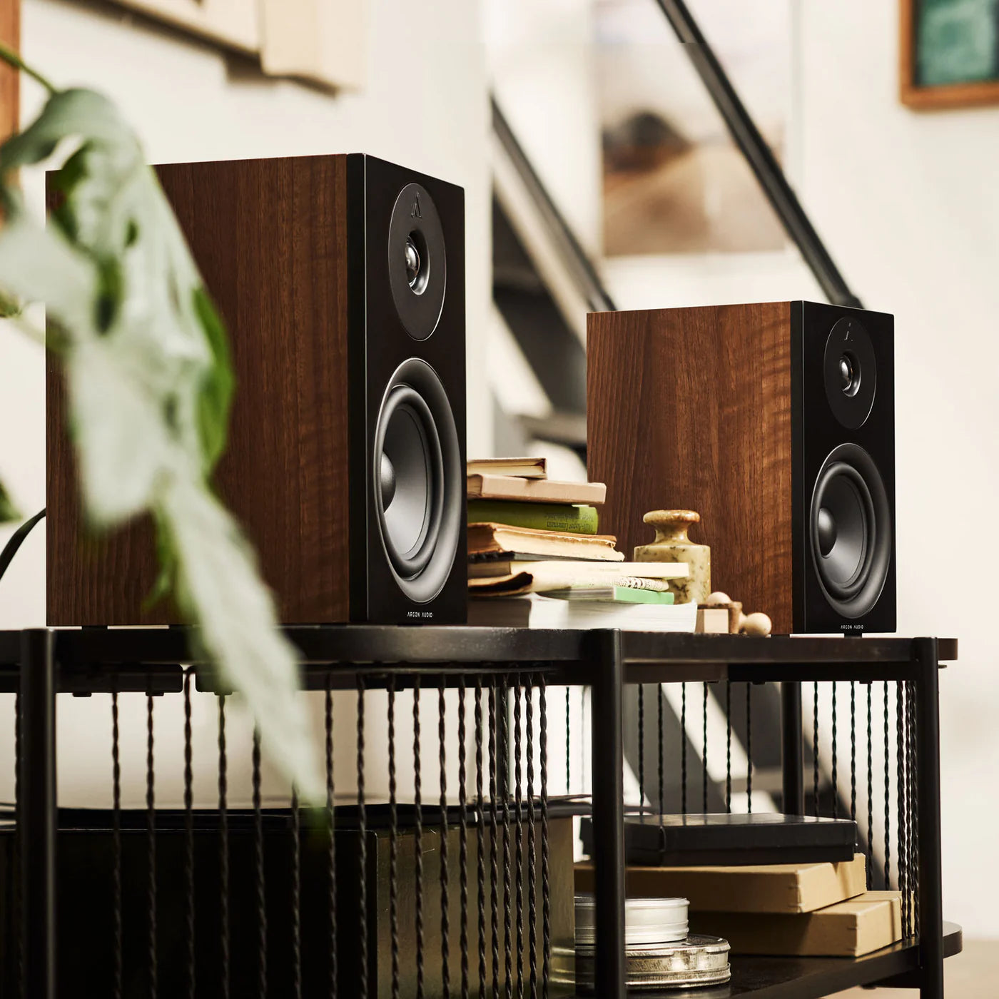 Argon Audio Forus 5 passive bookshelf speakers with wood finish, showing front view with speaker grille and sleek design.