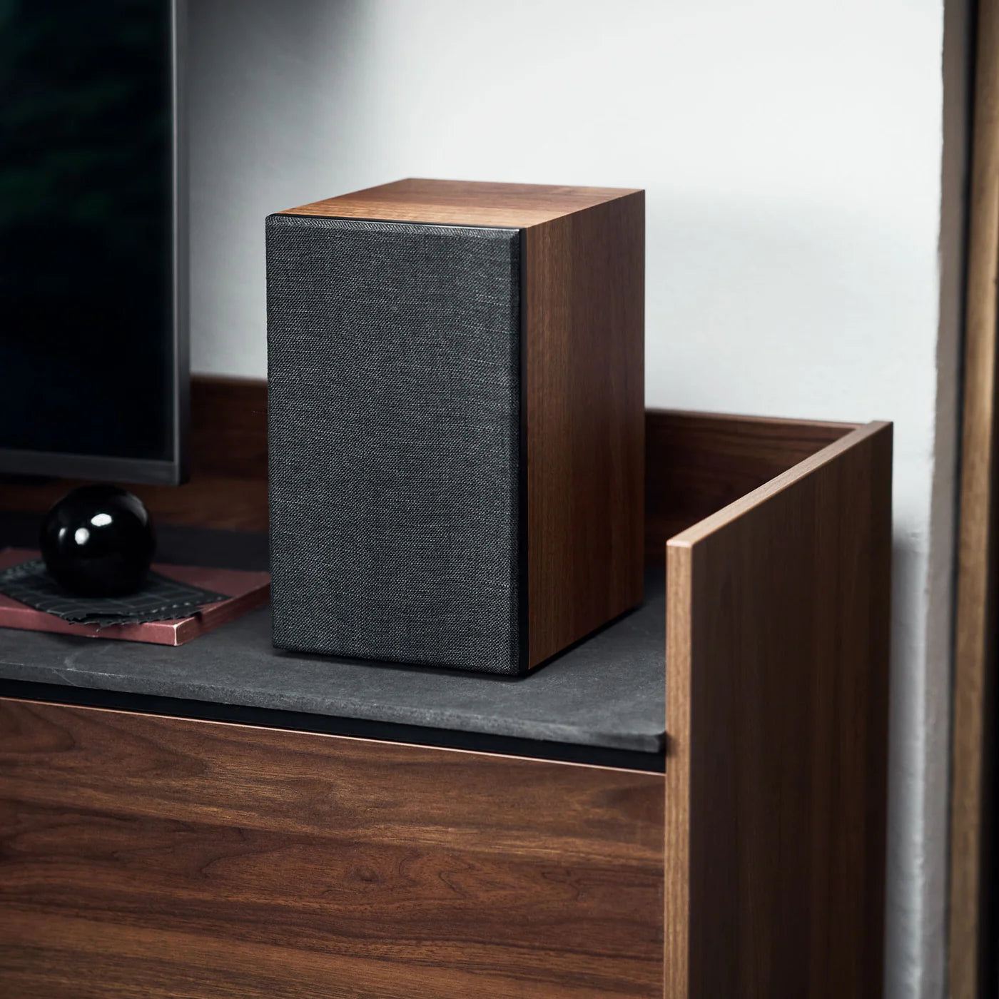 Argon Audio Forus 5 passive bookshelf speakers with black wood finish, showcasing sleek design and detailed speaker grilles.