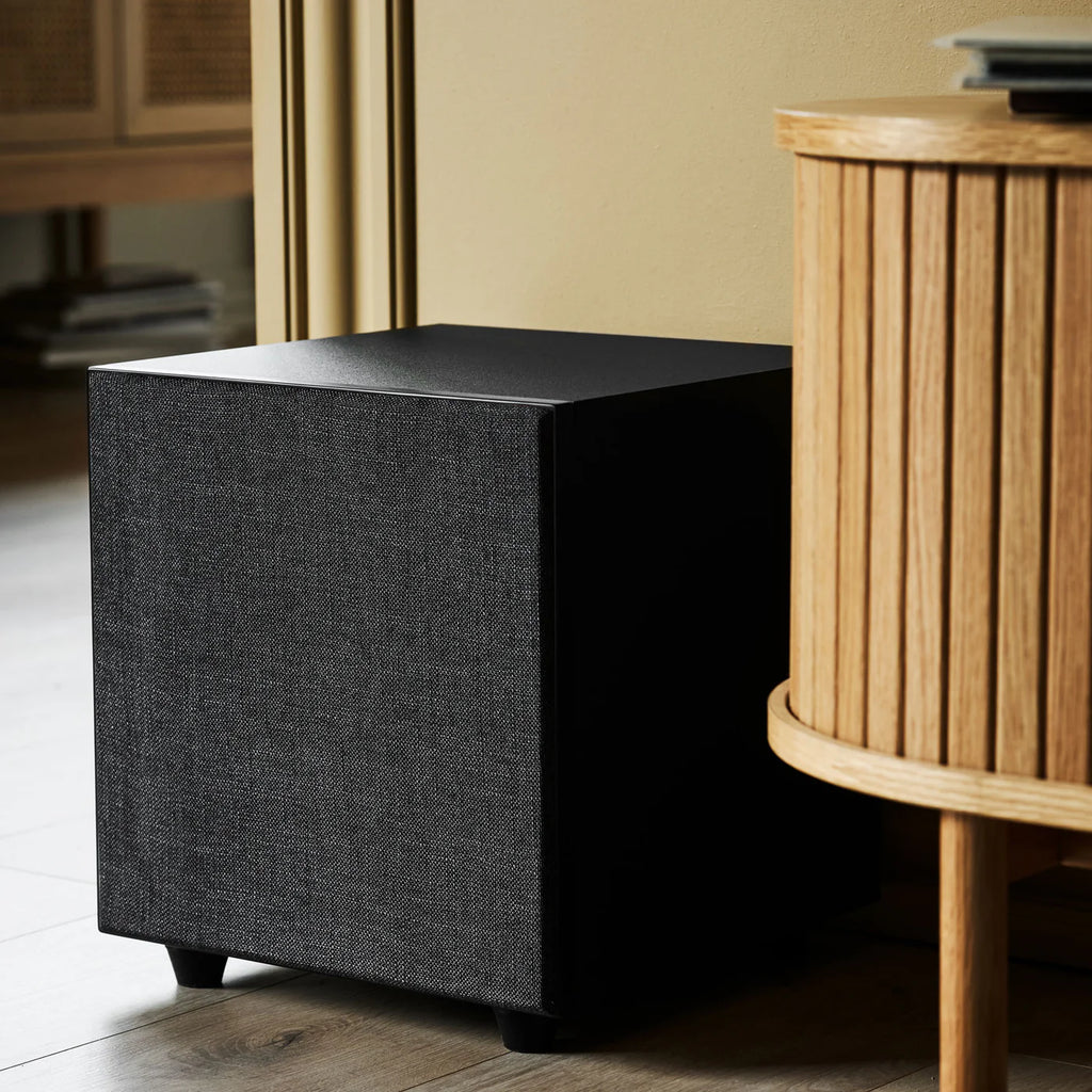 Black Argon Audio Malmö Sub 10 subwoofer showing the front grille and control panel, designed for deep bass audio.