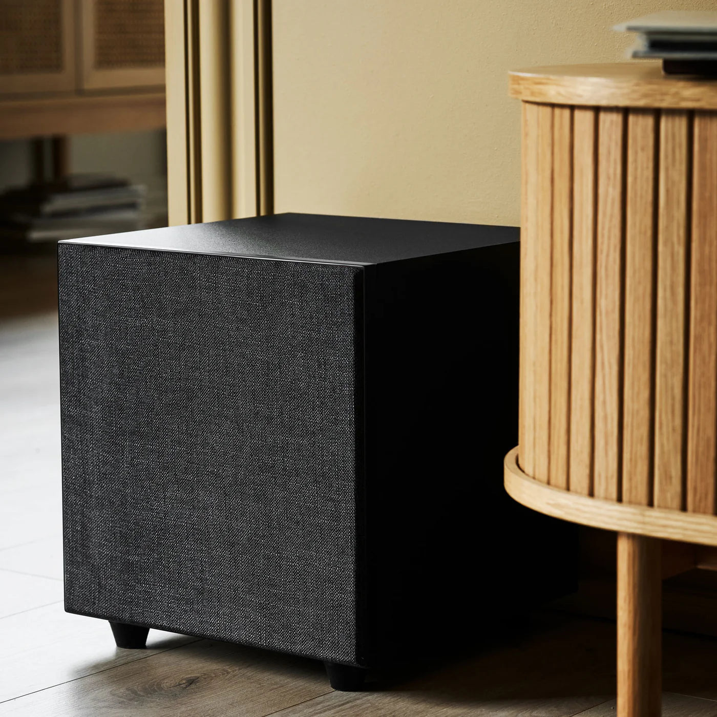Black Argon Audio Malmö Sub 10 subwoofer showing the front grille and control panel, designed for deep bass audio.