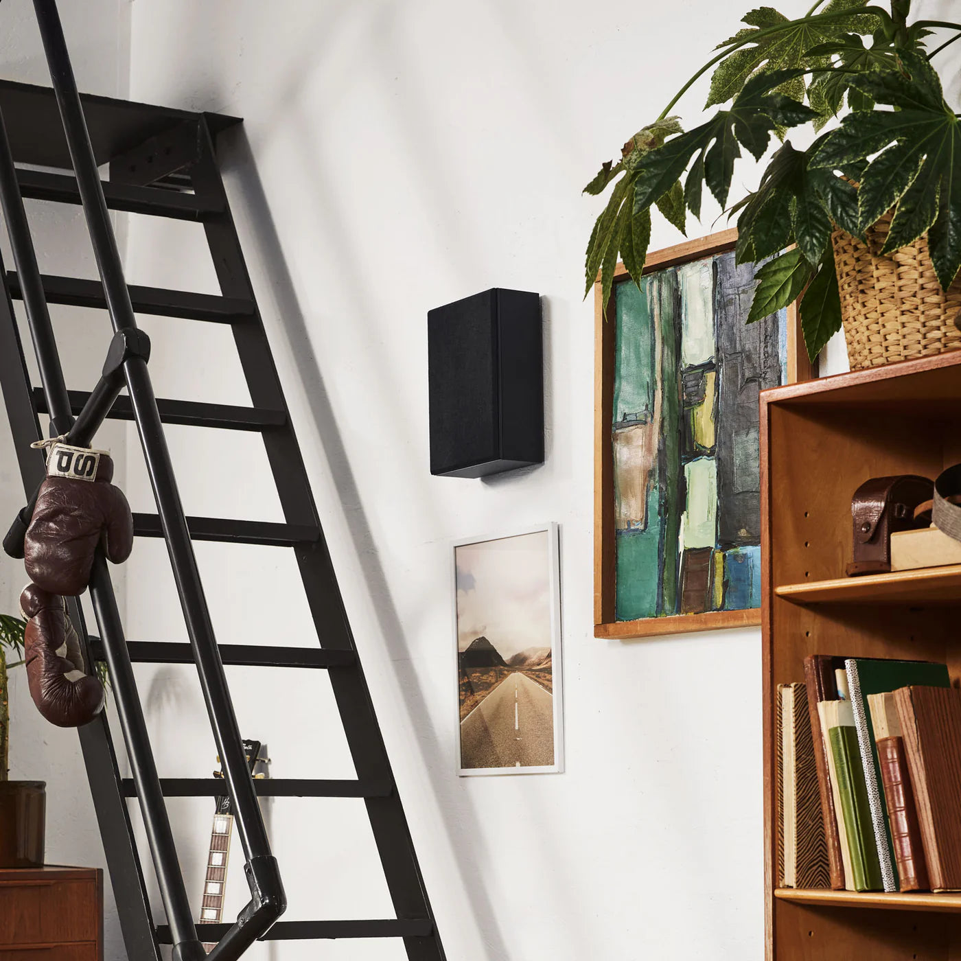 Black Argon Audio Forus 4 in-wall and outdoor speakers installed in a wall, showcasing sleek design and weather-resistant features.
