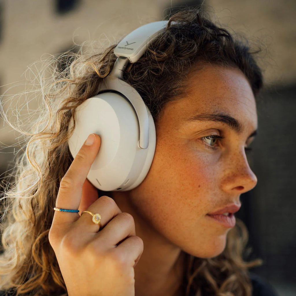Beyerdynamic Aventho 300 wireless headphones shown in a lifestyle setting with sleek design and over-ear comfort.