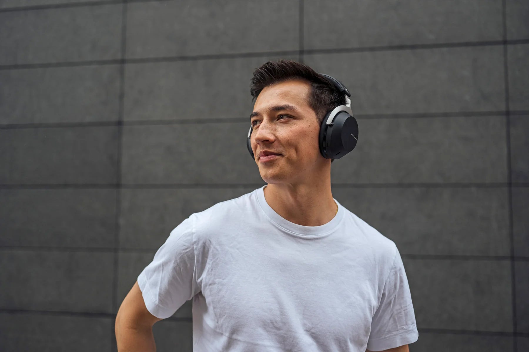 Wireless Beyerdynamic Aventho 300 headphones with over-ear design and sleek black finish, shown from a side angle.