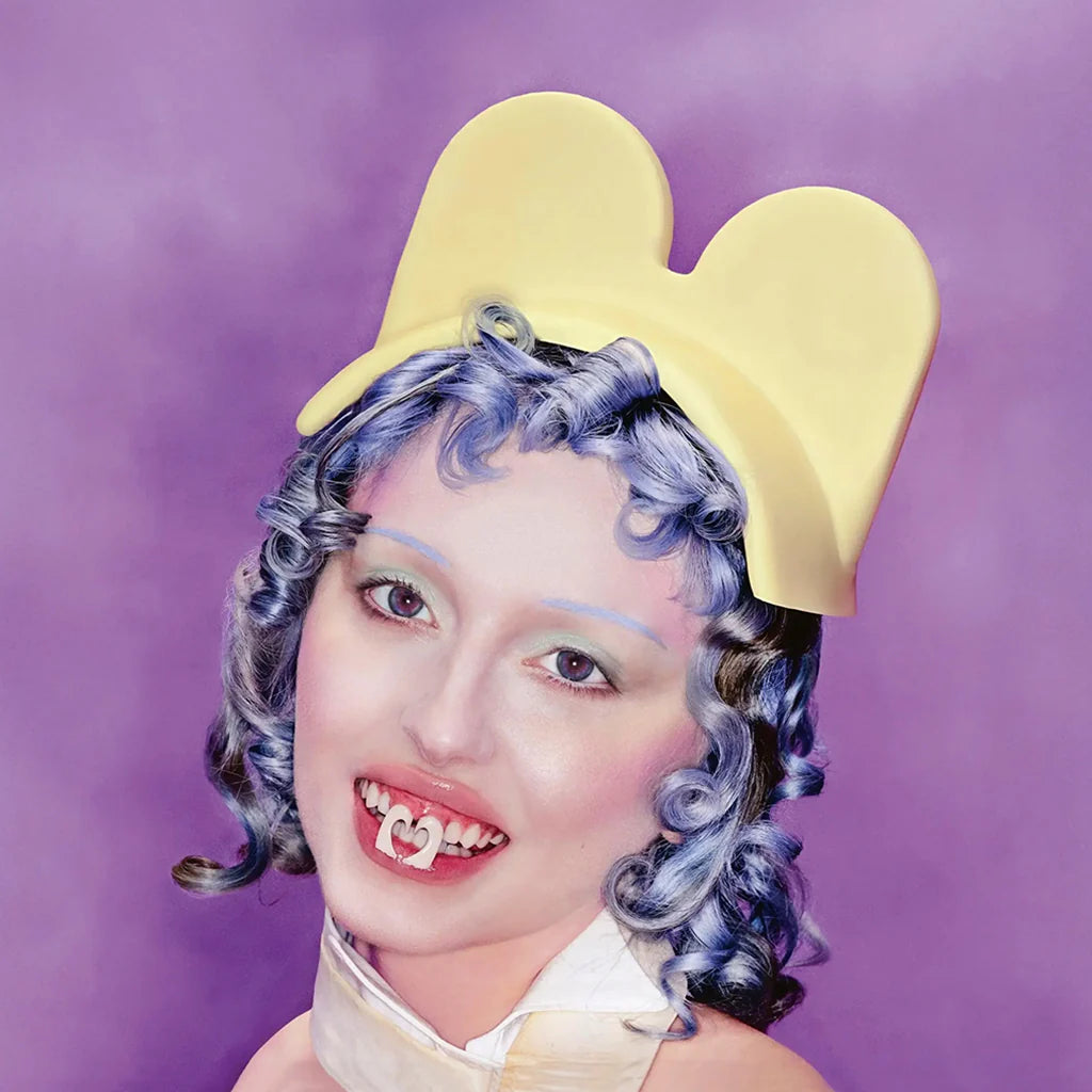 Yellow vinyl LP of Ashnikko's Smoochies album, featuring rock, indie, and pop music by Warner Music Group.