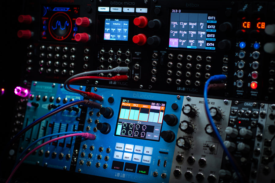 1010music Bluebox Eurorack modular synthesizer with colorful knobs and patch points, designed for versatile sound creation.