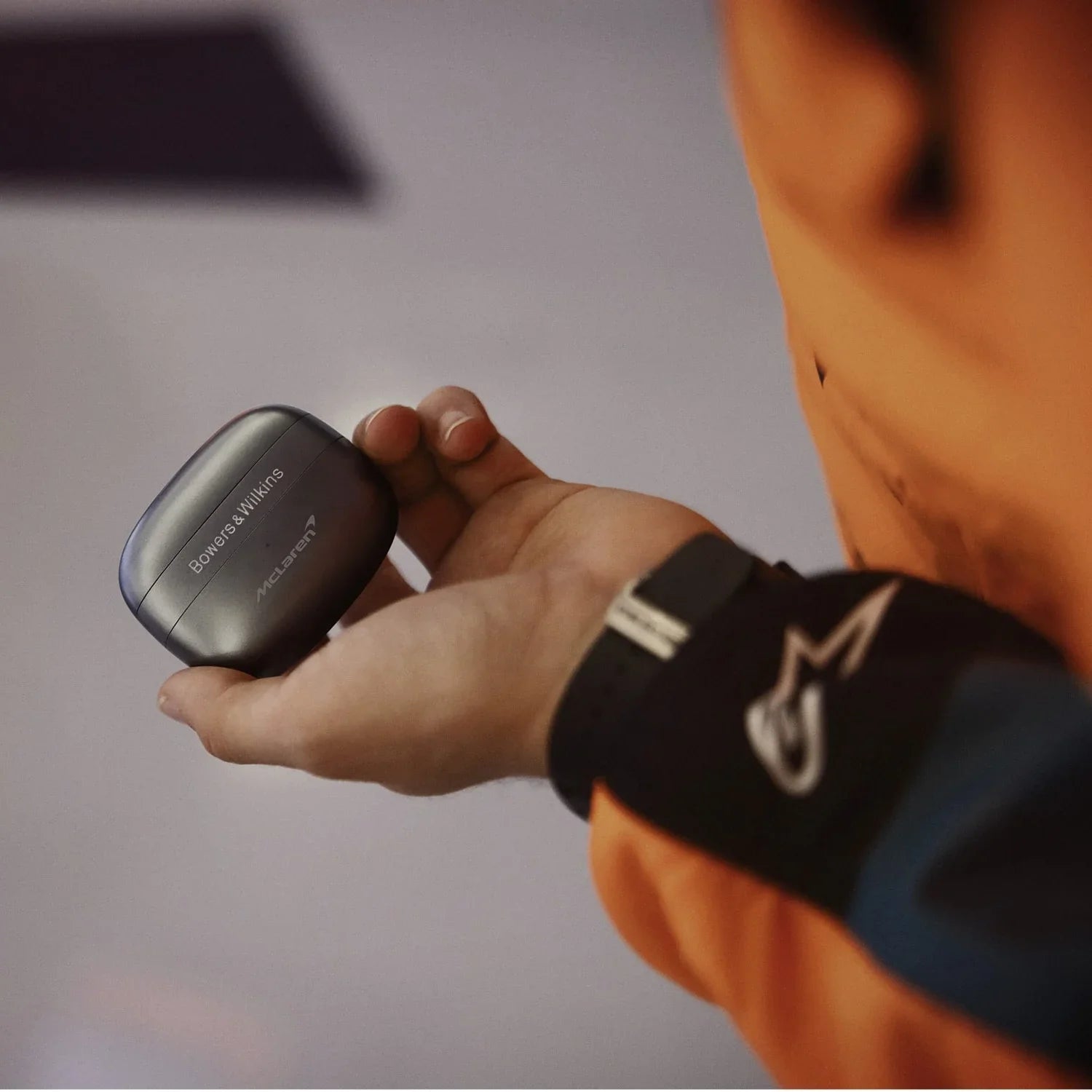 Bowers & Wilkins Pi8 wireless in-ear headphones with sleek black design and charging case, showcasing in-ear earbuds and accessories.