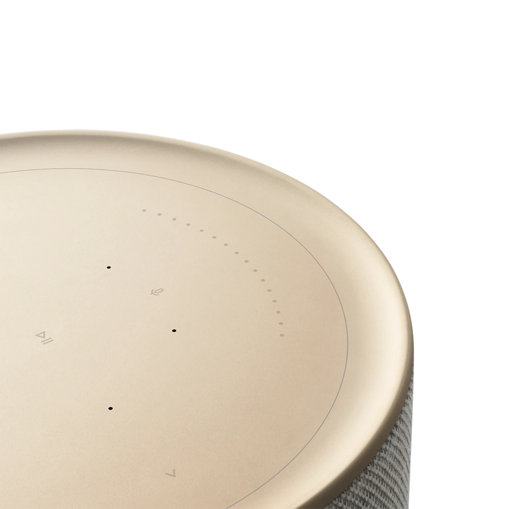 Bang & Olufsen Beosound Balance wireless speaker with a sleek natural wood finish and modern design, shown in detailed close-up.