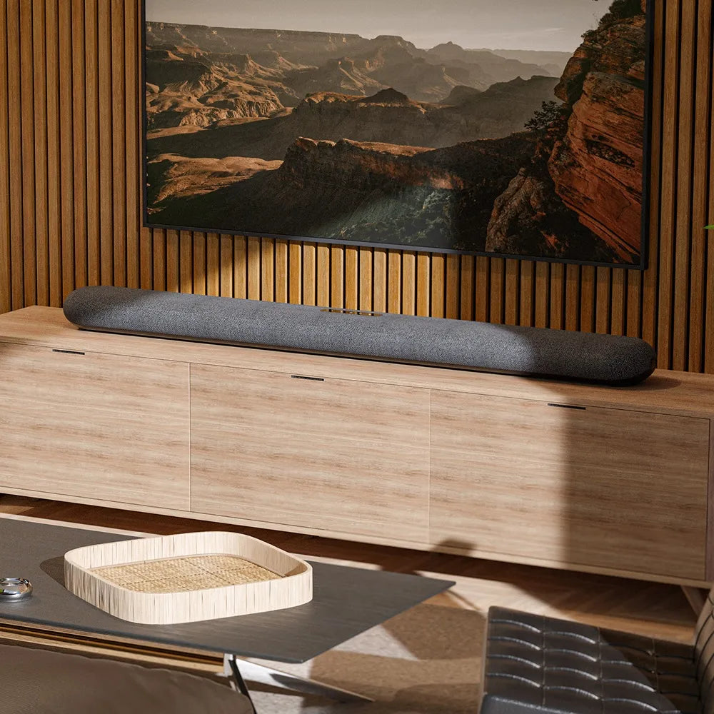 Bluesound Pulse Cinema soundbar with sleek design and multiple speaker drivers for immersive TV audio experience.