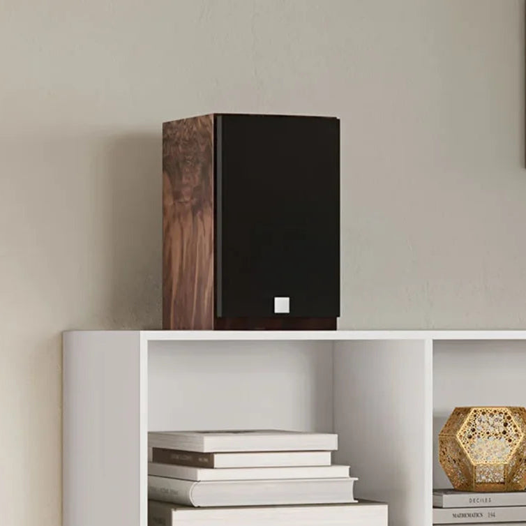DALI Menuet SE passive bookshelf speakers with wild walnut finish, ideal for stylish home audio setups.