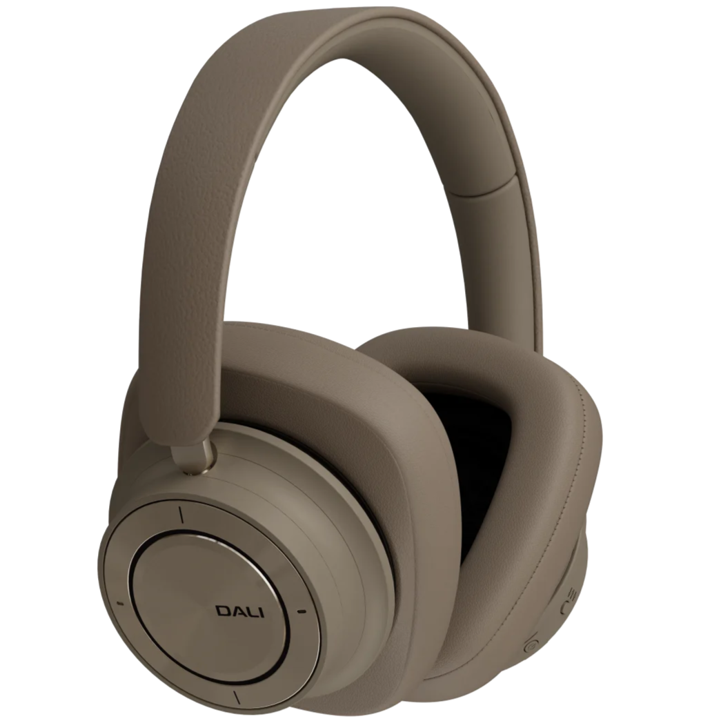 DALI iO-12 Mocha Grey wireless headphones with sleek design and cushioned ear cups, resting on a neutral background.