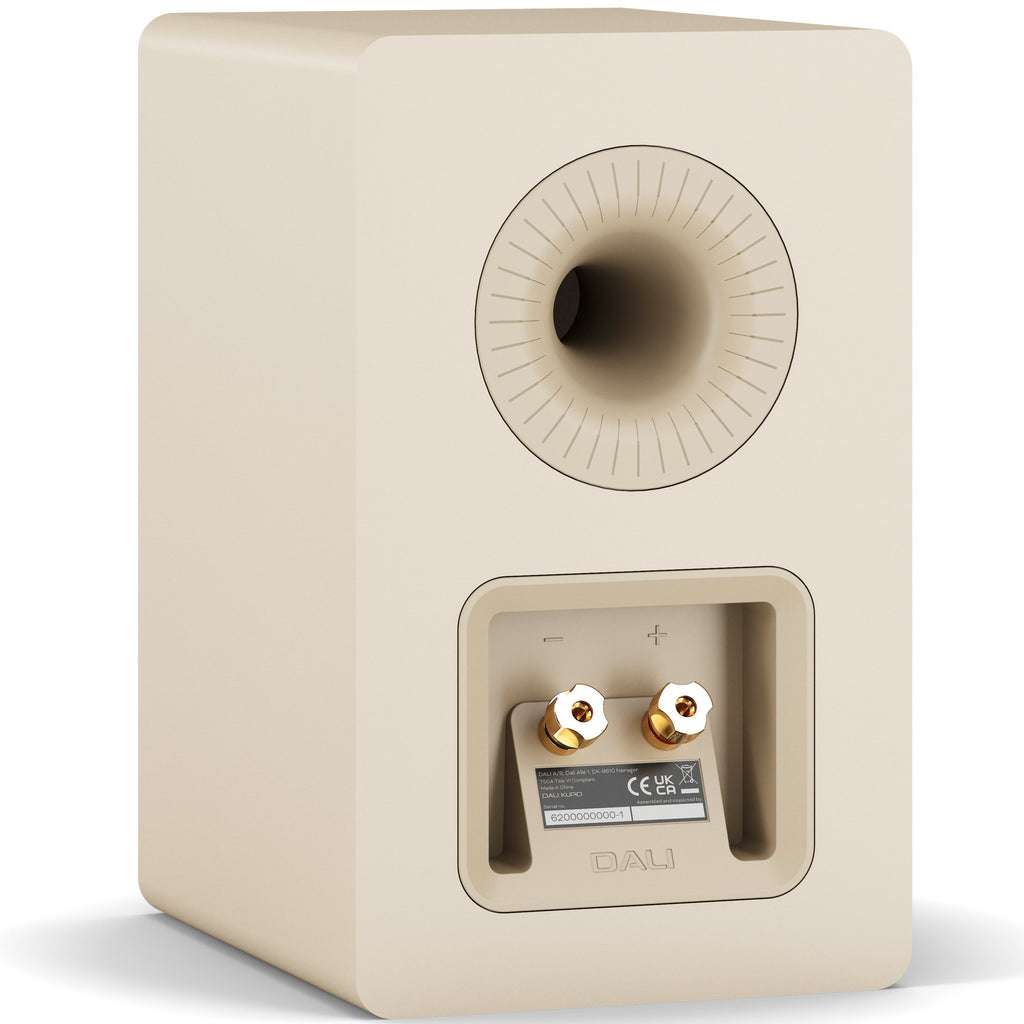 DALI Kupid passive bookshelf speakers with caramel white grill, showcasing their sleek compact design and modern aesthetic.