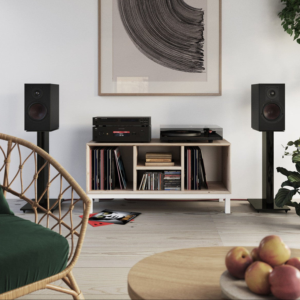 Black DALI Opticon 2 MK2 passive bookshelf speakers with sleek design and wood finish, showing the front grille and speaker cones.