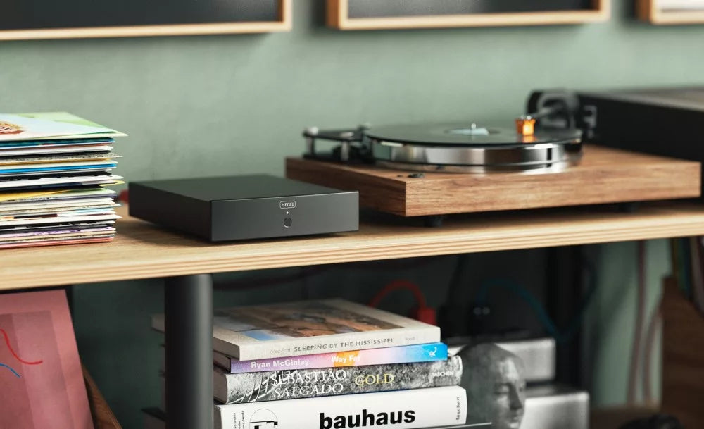 Hegel V10 phono preamp with sleek black design and control knobs, showcasing high-quality audio equipment for vinyl records.