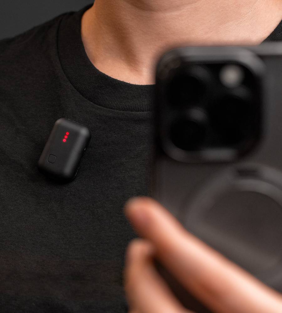 Instamic Pro Plus C portable recorder with microphone, compact design, and streaming capabilities, shown in a close-up image.