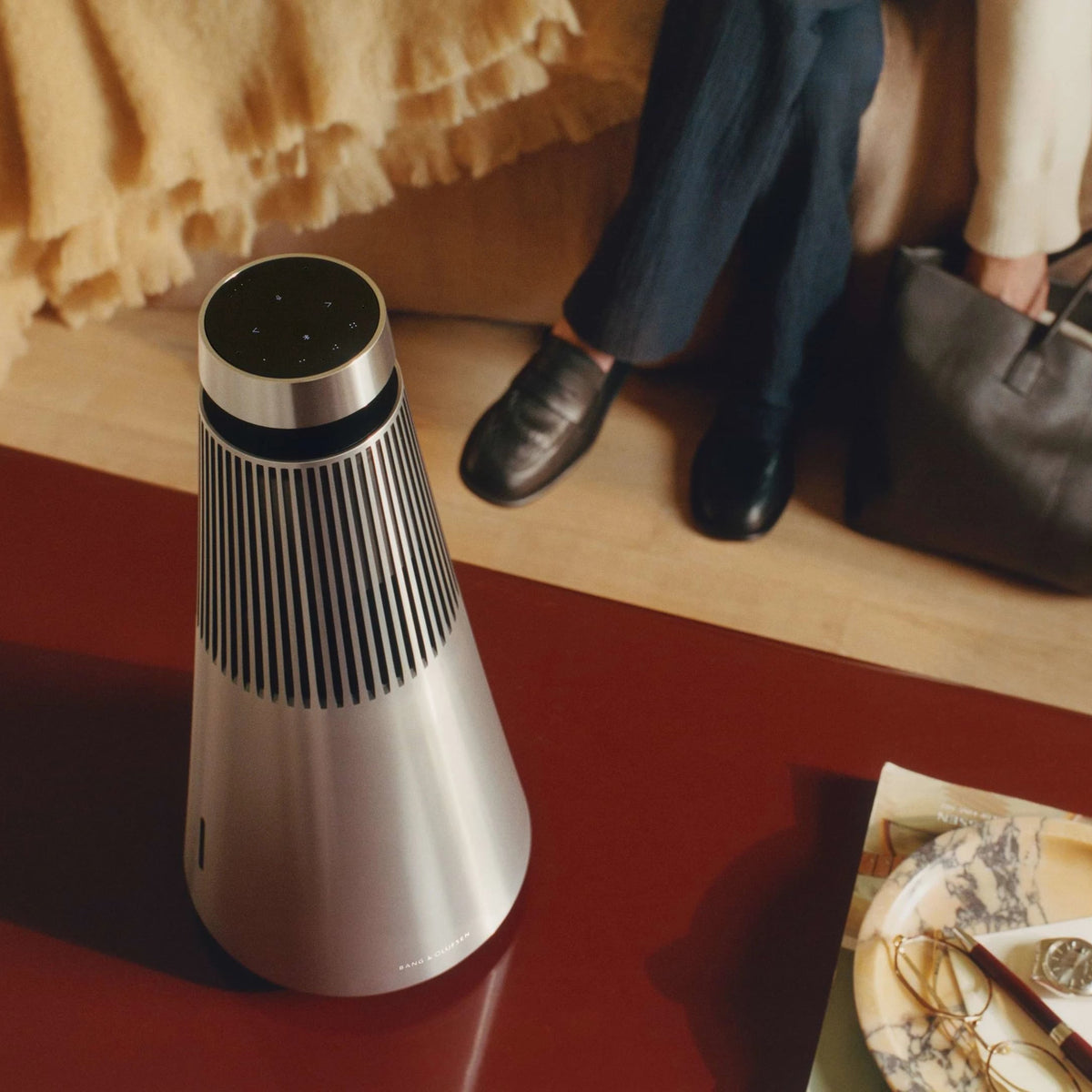 Bang & Olufsen Beosound 2 3rd Gen wireless speaker in a stylish home setting with sleek design and premium finish.