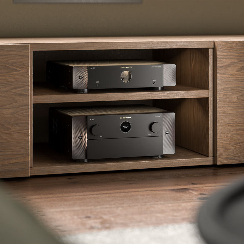 Marantz AV 30 stereo amplifier with sleek black design and control knobs, showcasing advanced audio technology.