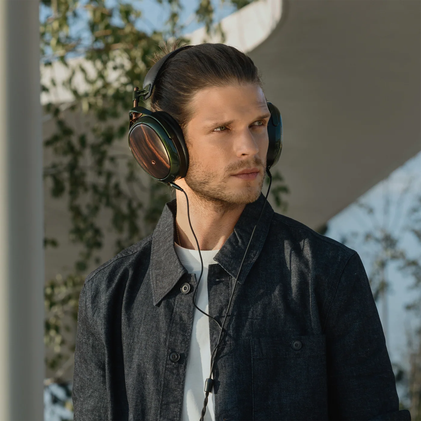 Meze Audio Strada wired headphones with sleek black design and over-ear cushions, showing the high-quality ear cups and headband.