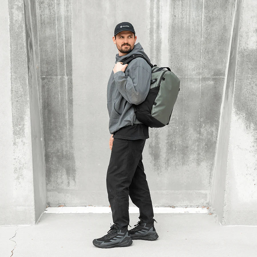 Green Wandrd Nimbus 18L video equipment bag with padded compartments and adjustable straps for safe gear transport.