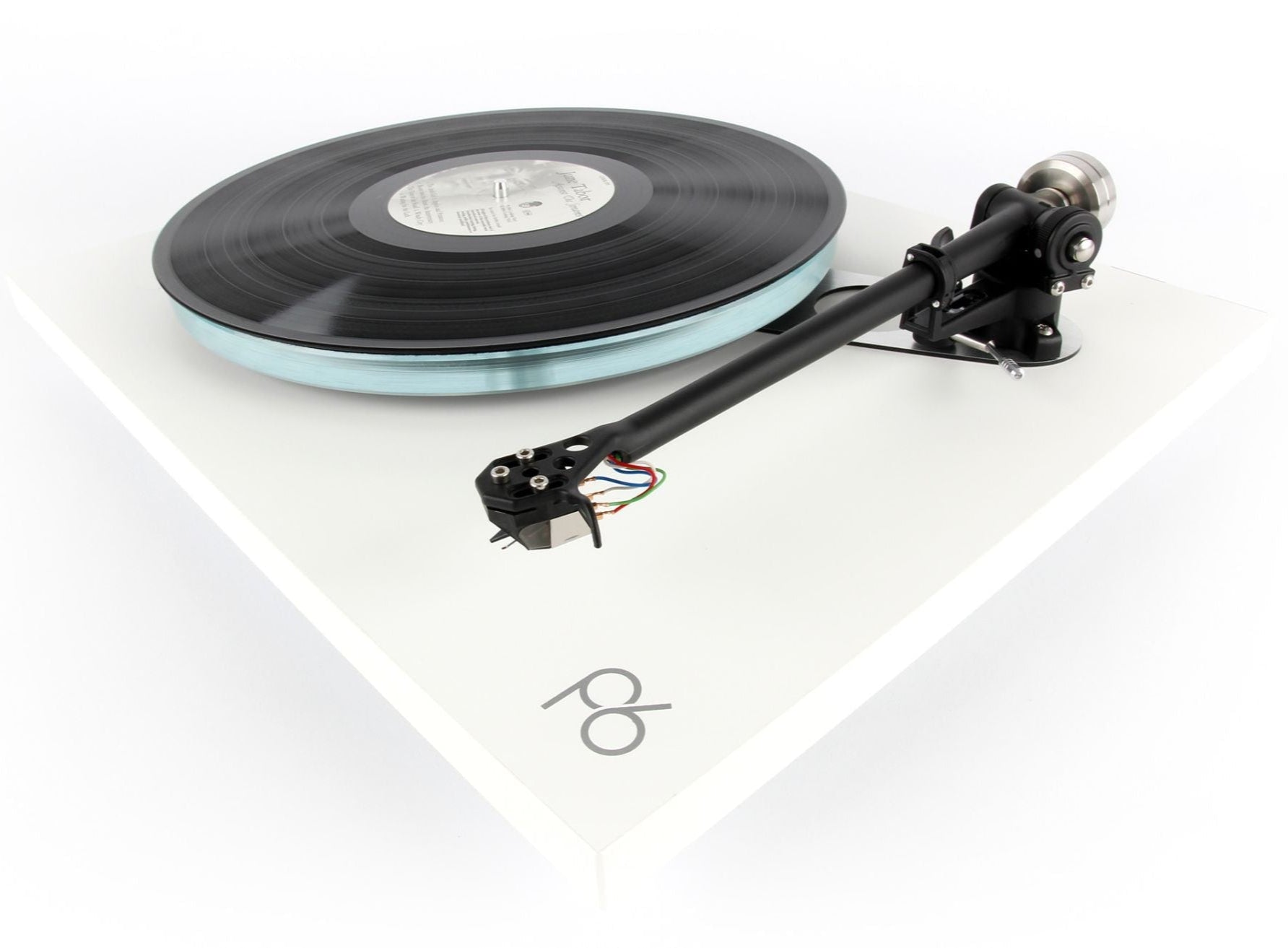 Rega ND5 turntable cartridge mounted on a turntable, showcasing its sleek design and branding.