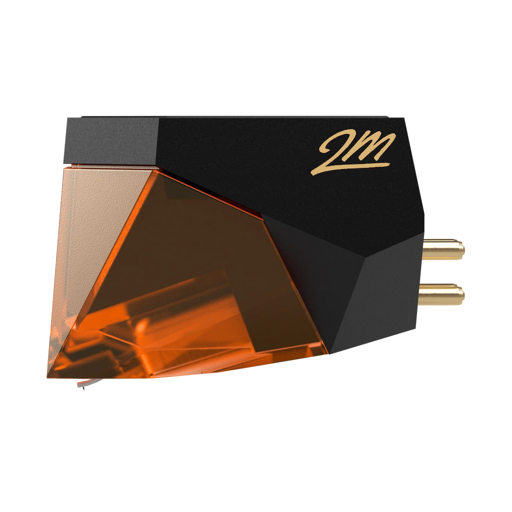 Ortofon 2M Bronze turntable cartridge with a metal stylus and sleek design, viewed from the side left angle.