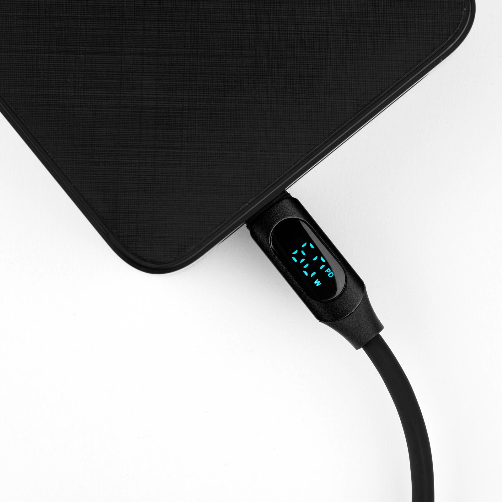 myVolts USB-A to USB-C PD cable with LCD power meter showing connection and charging status in a close-up shot.