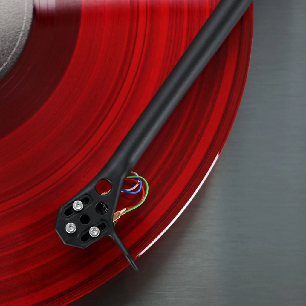 Rega Planar 3 RS turntable with aluminum platter and Nd5 cartridge, viewed from above showing the vinyl record and tonearm.
