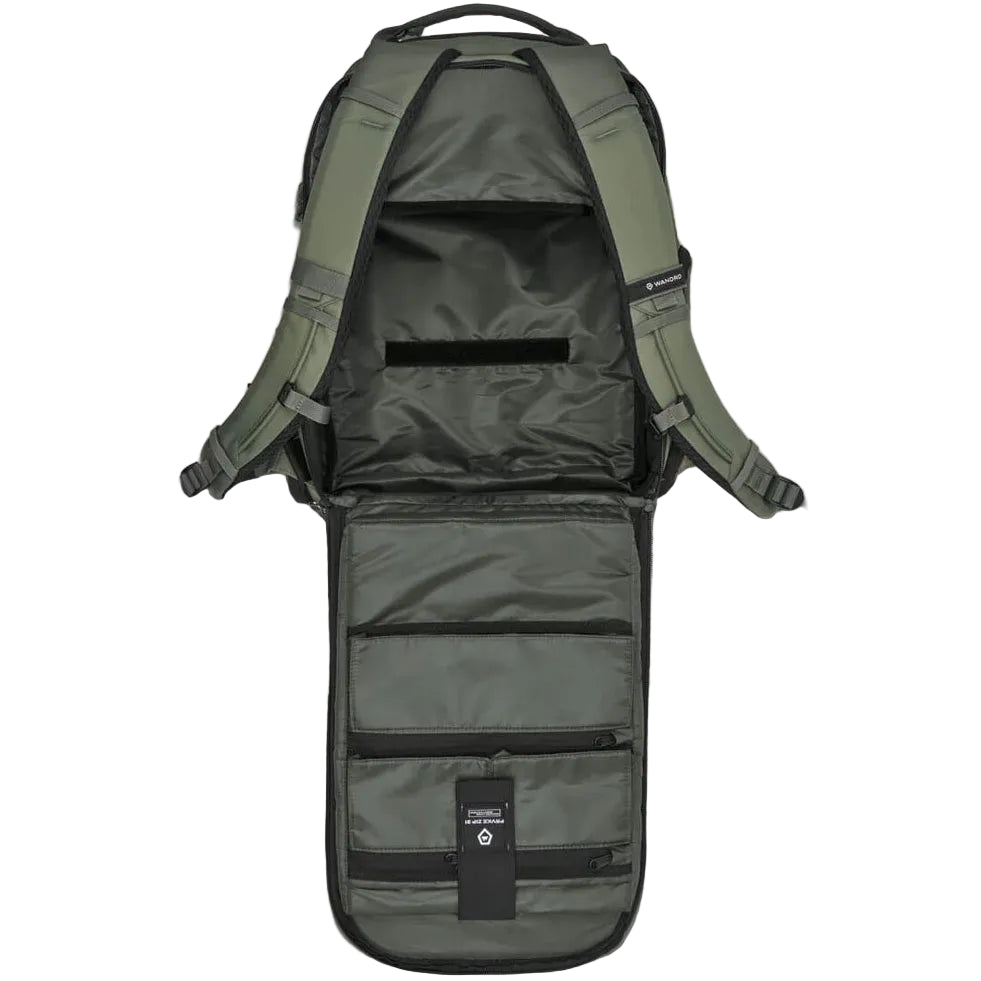 Wandrd Prvke Zip video equipment bag with green exterior and divider, designed for safe, organized storage of camera gear.