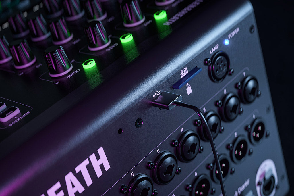 Allen & Heath Qu-5 digital mixer with USB-C and SD card slots, featuring multiple input and output controls on a professional audio interface.