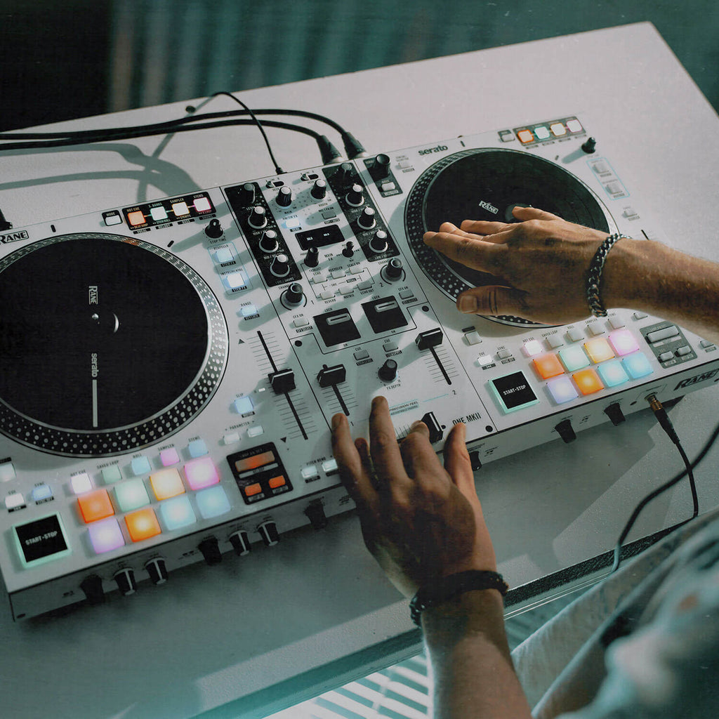 Rane One MKII DJ controller with jog wheels, mixer, and control knobs for professional DJ mixing and performance.