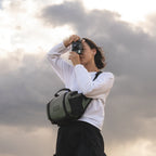 Wandrd Rogue Sling bag in Wasatch Green, a compact video equipment case with adjustable strap and multiple compartments.
