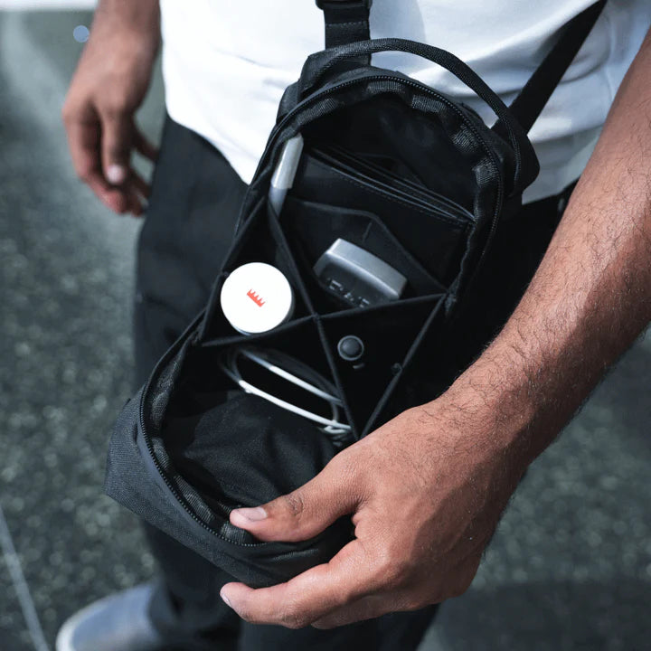 Wandrd X1 Cross Body video equipment bag with padded compartments and adjustable strap, designed for camera gear and accessories.