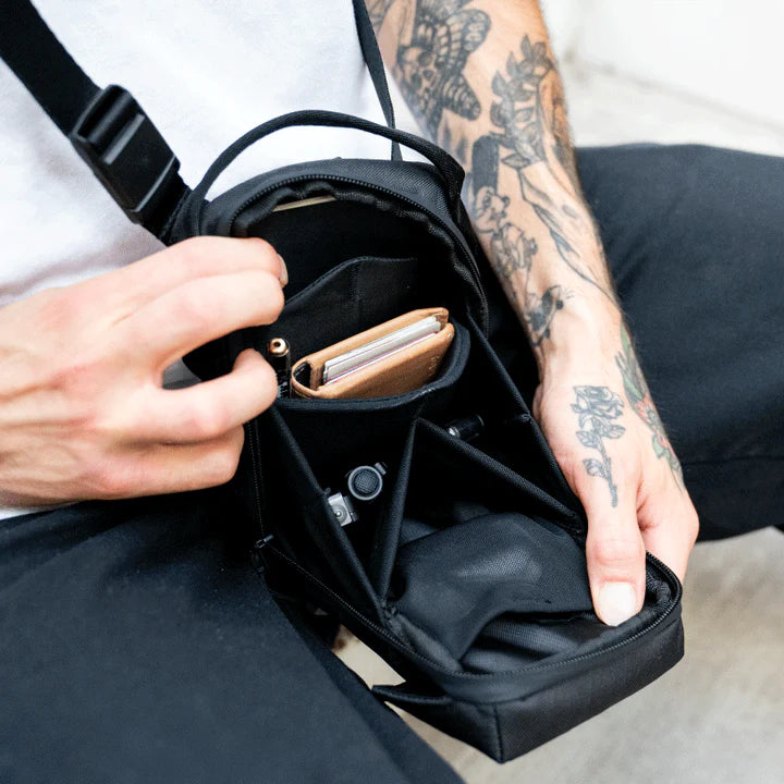 Wandrd X1 Cross Body video equipment bag with padded compartments and adjustable strap for camera gear storage.