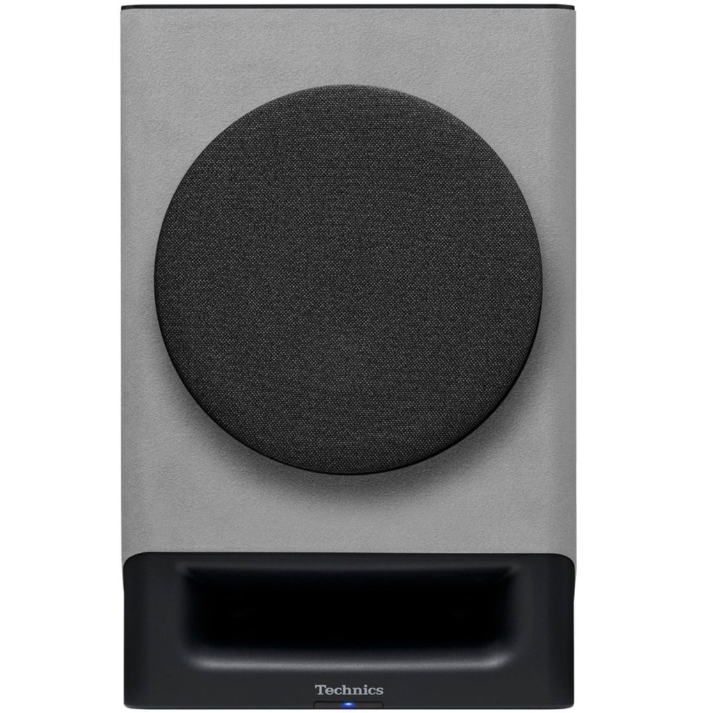 Technics SC-CX700 active bookshelf speakers in gray with front covers, compact design, and modern audio equipment appearance.