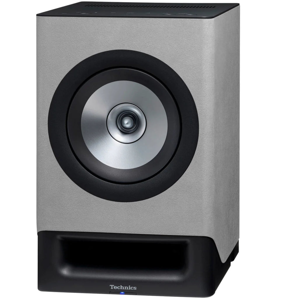 Technics SC-CX700 gray active bookshelf speakers with a sleek front design and compact build for quality sound.
