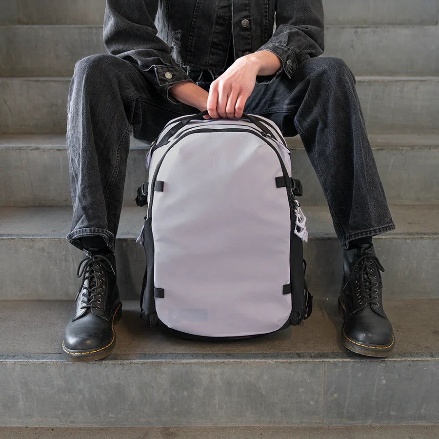 Wandrd Stratus Photo 18L video equipment bag in Uyuni Purple with padded compartments and adjustable straps.