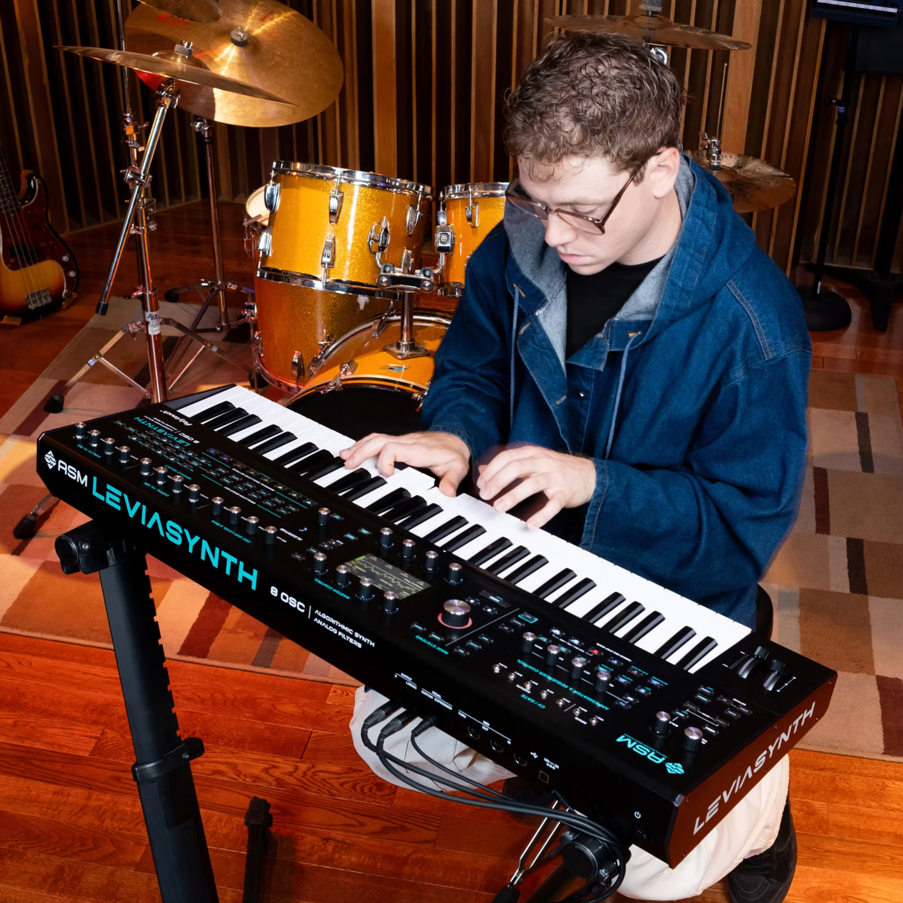 ASM Leviasynth keyboard synthesizer with a sleek black design and multiple control knobs and keys for musical creativity.