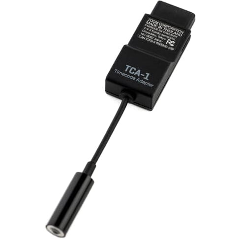 Zoom TCA-1TC-6 recorder accessory cable connected to a Zoom audio recorder, showcasing compatibility and professional recording setup.