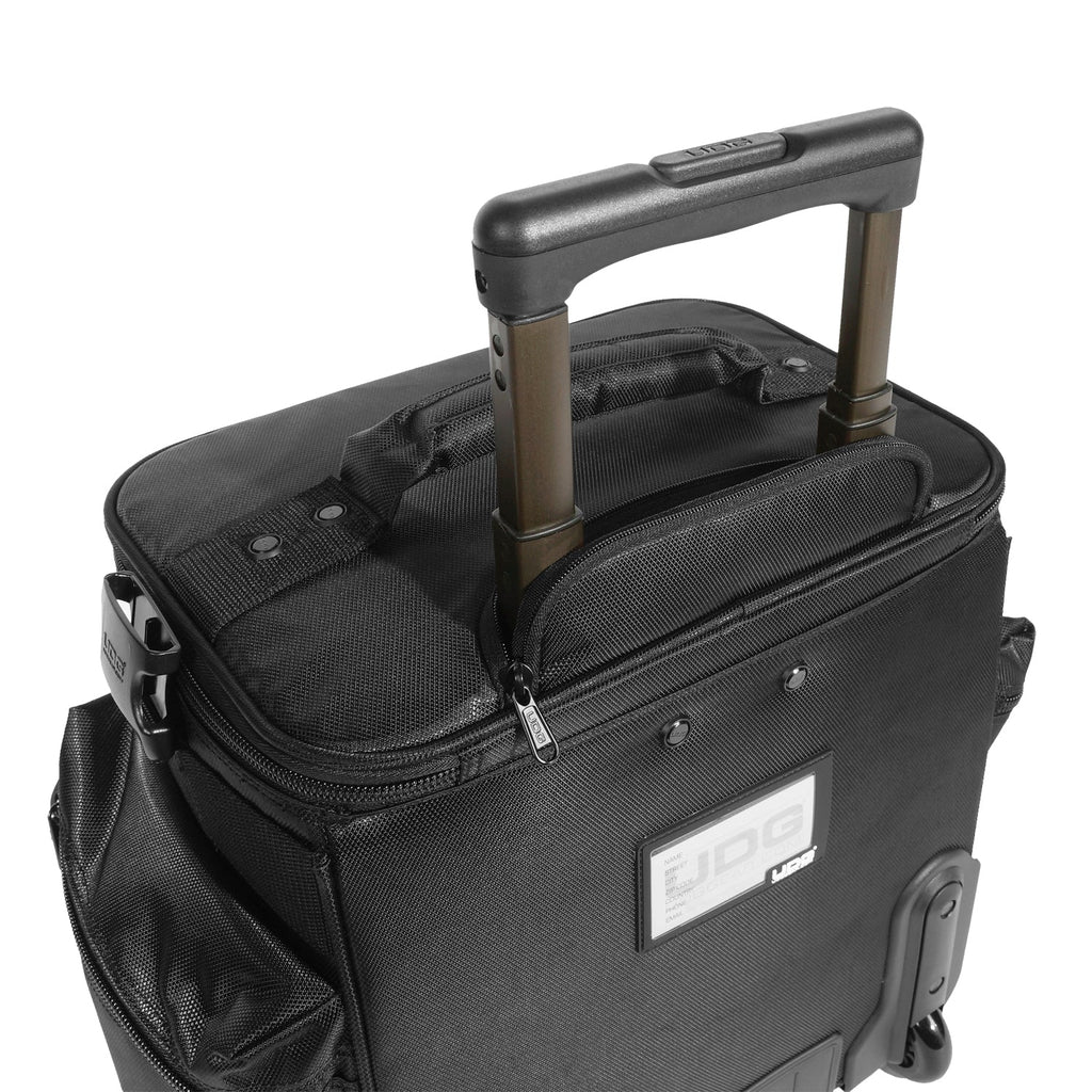 UDG SlingBag Trolley Deluxe MK2 in black, featuring wheels and adjustable straps for DJs on the go.