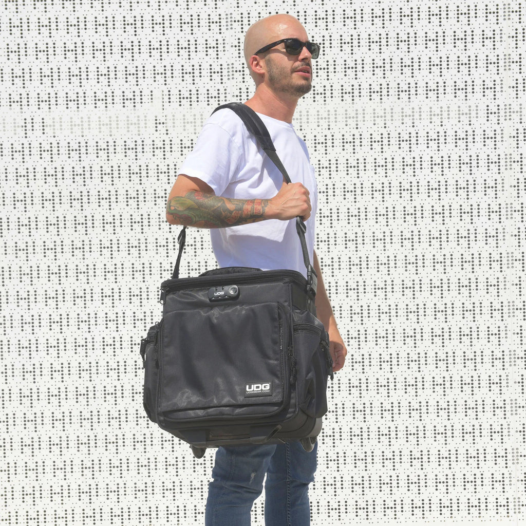 UDG SlingBag Trolley Deluxe MK2 in black, featuring wheels and a spacious design for DJ equipment and essentials.