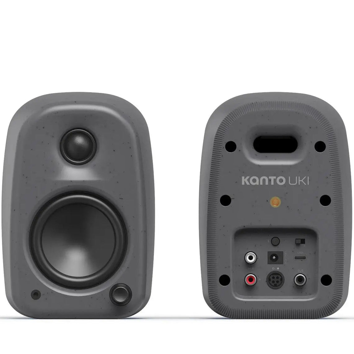 Kanto Audio UKI desktop speakers with dual straight design, compact black speakers for high-quality audio on a workspace.