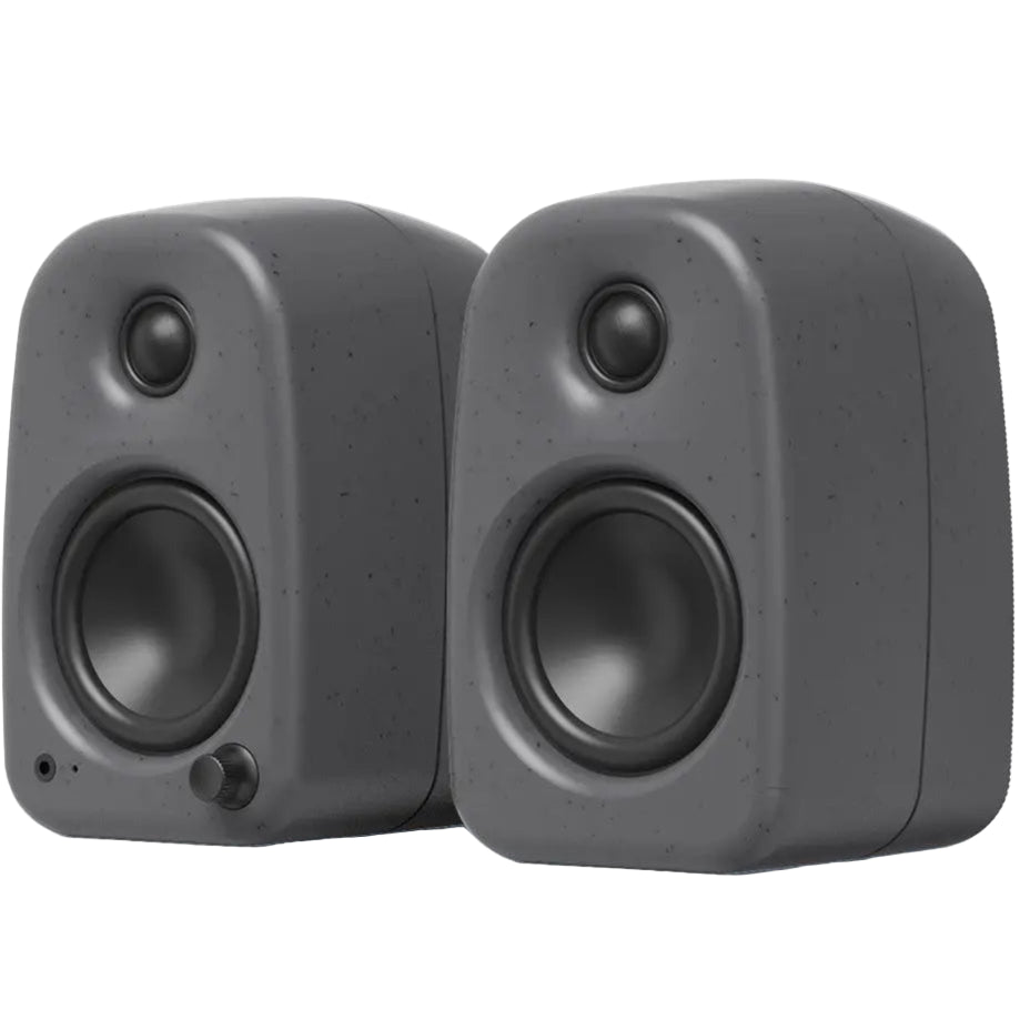 Kanto Audio UKI desktop speakers with sleek black finish and front speaker grille, designed for high-quality audio on a desk.