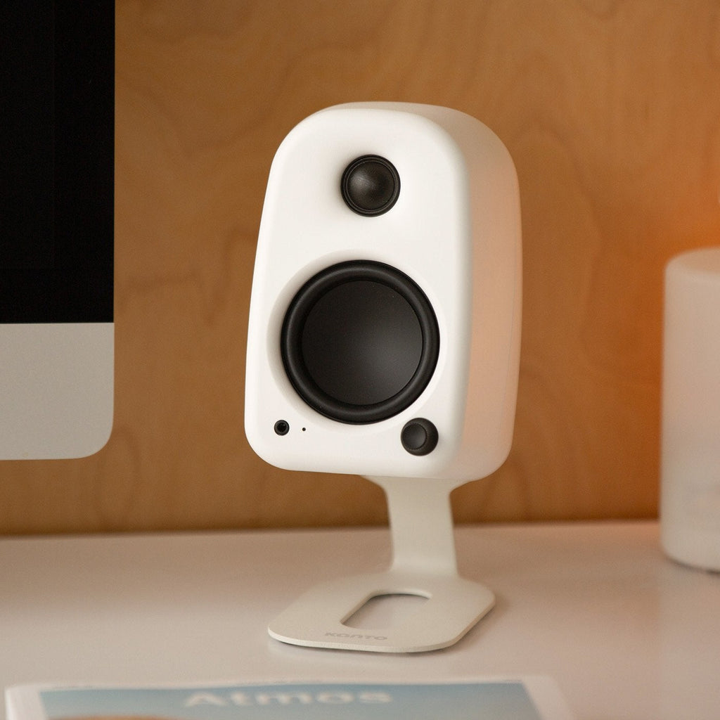 Kanto Audio UKI desktop speakers in black, showing sleek design and compact size suitable for desktop audio setup.