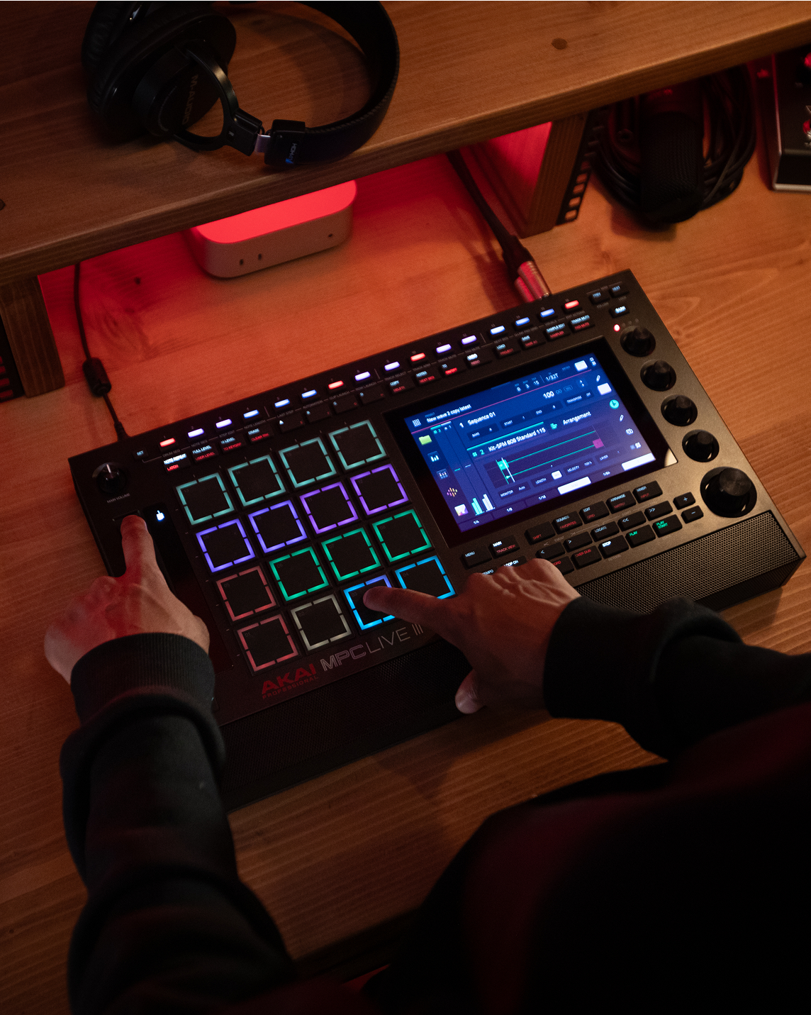 Akai Professional MPC Live III drum machine and sampler with a sleek, modern design and colorful control interface.