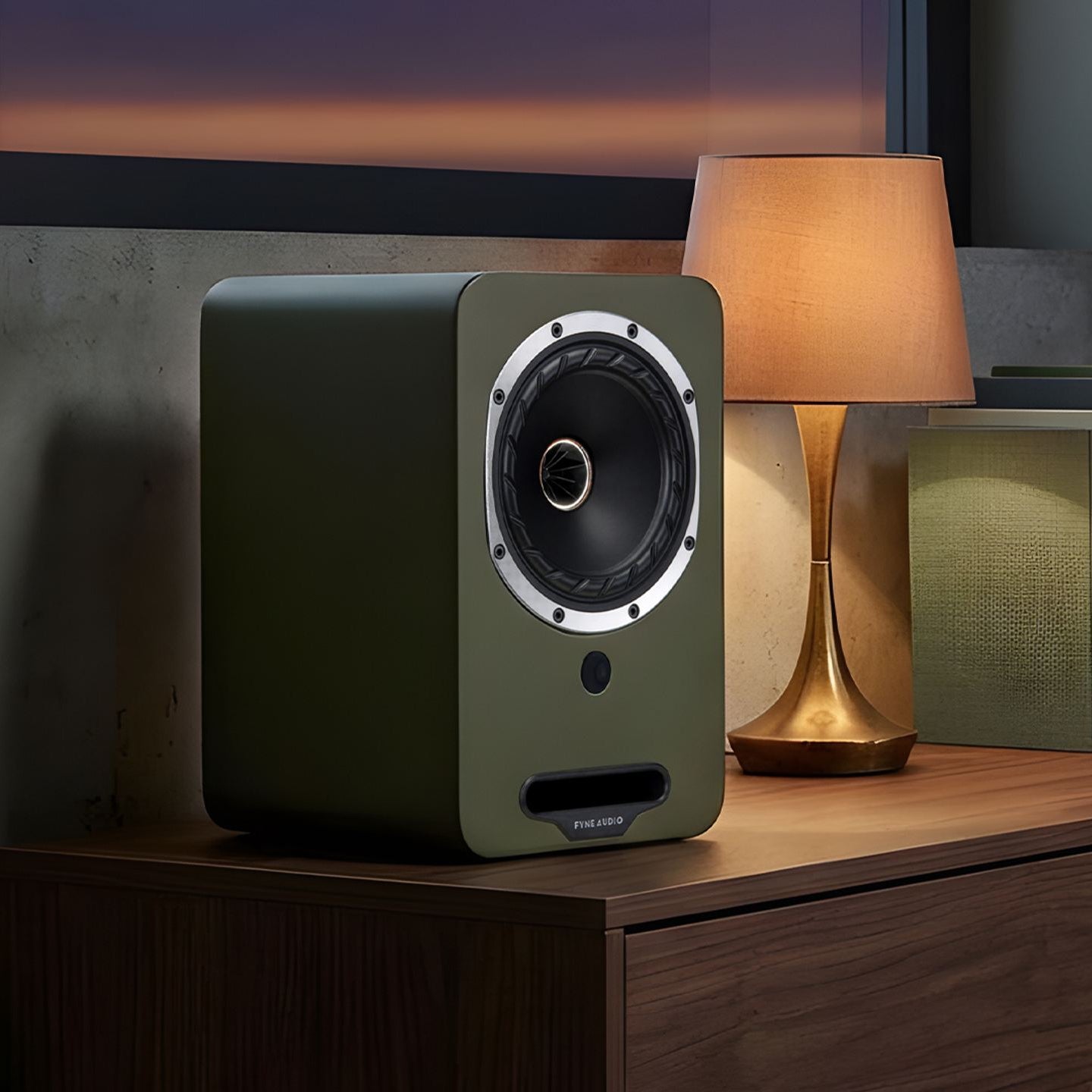Fyne Audio Cubitt 5 active bookshelf speakers with sleek black finish and modern design, displayed on a wooden surface.