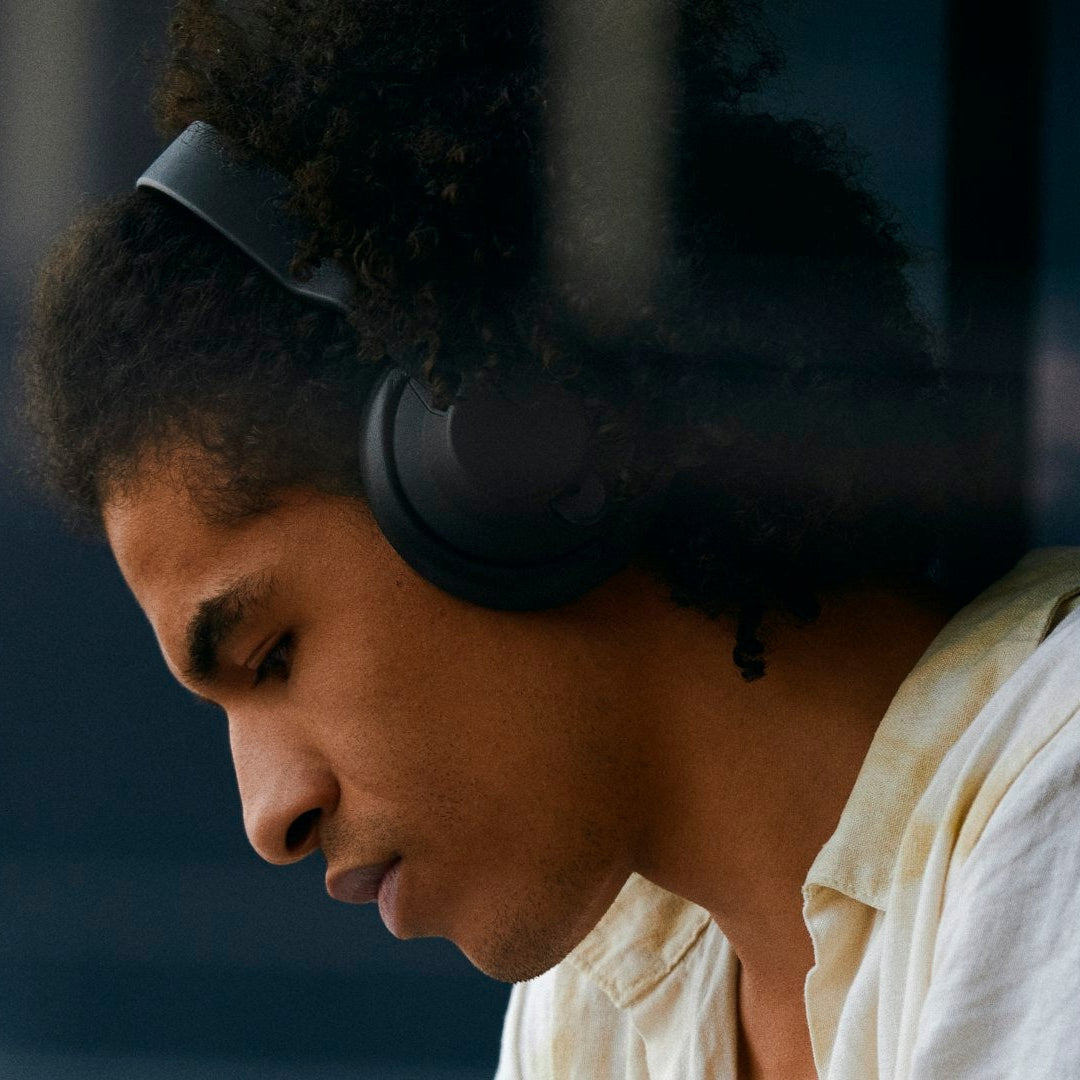 AIAIAI TMA-2 Move Wireless headphones in black, featuring over-ear design and modern control buttons, on a neutral background.