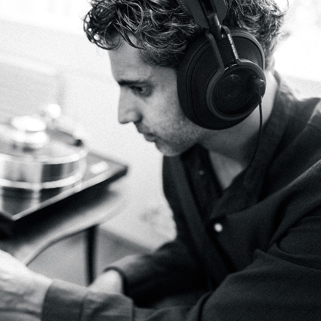 Austrian Audio The Composer wired headphones in black, featuring over-ear design and plush ear cushions for professional audio listening.