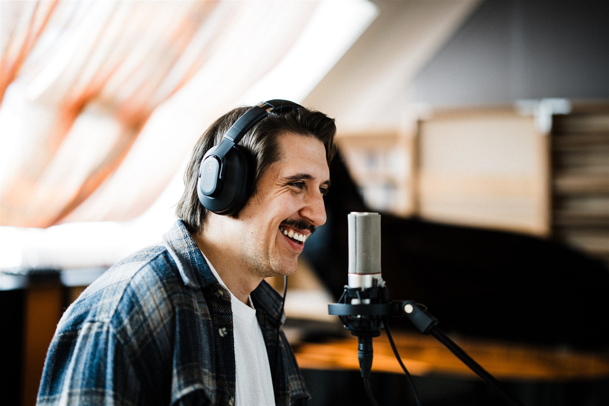 Austrian Audio Hi-X20 studio headphones with black ear cups and adjustable headband, designed for professional audio monitoring.
