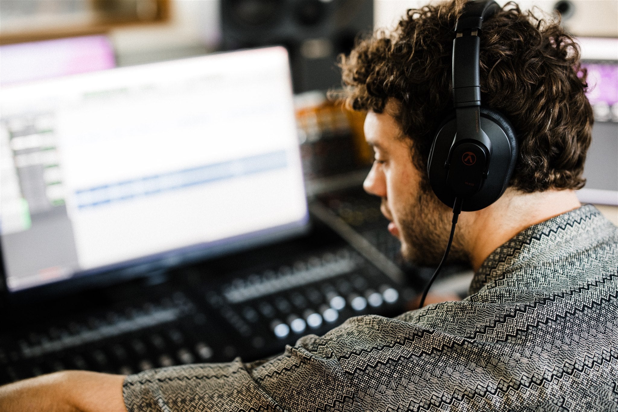 Austrian Audio Hi-X20 studio headphones with black over-ear design, detailed ear cups, and adjustable headband for professional audio listening.